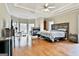 Expansive main bedroom featuring a fireplace, hardwood floors, and trey ceiling at 165 Standing Oak Pl, Fayetteville, GA 30214
