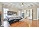 This main bedroom features hardwood floors, natural light and an ensuite at 165 Standing Oak Pl, Fayetteville, GA 30214