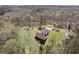 Aerial view of the home on a spacious lot surrounded by lush trees at 7395 Old Rico Rd., Chattahoochee Hills, GA 30268