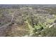 Wide aerial shot of wooded and open land, showcasing the location of the estate at 7395 Old Rico Rd., Chattahoochee Hills, GA 30268