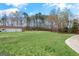Expansive backyard with a detached garage, playground, and lush green grass at 7395 Old Rico Rd., Chattahoochee Hills, GA 30268
