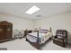 Finished basement as bedroom with bed and dressers and chairs at 7395 Old Rico Rd., Chattahoochee Hills, GA 30268