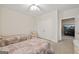 Neutral carpeted bedroom featuring two beds and a large closet, perfect for a shared space at 7395 Old Rico Rd., Chattahoochee Hills, GA 30268