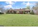 Charming one-story brick home with well-manicured lawn and tasteful landscaping at 7395 Old Rico Rd., Chattahoochee Hills, GA 30268
