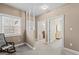 Bright hallway with a window and staircase and entrances to other rooms and bathroom at 7395 Old Rico Rd., Chattahoochee Hills, GA 30268
