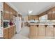 Well-maintained kitchen with light wood cabinetry, white appliances, and ample counter space at 7395 Old Rico Rd., Chattahoochee Hills, GA 30268
