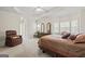 Spacious main bedroom with trey ceiling, plush carpet, and natural light at 7395 Old Rico Rd., Chattahoochee Hills, GA 30268