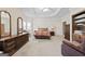 Spacious main bedroom with trey ceiling, plush carpet, and ample dresser storage at 7395 Old Rico Rd., Chattahoochee Hills, GA 30268