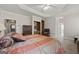 Spacious main bedroom with trey ceiling, plush carpet, and built-in storage at 7395 Old Rico Rd., Chattahoochee Hills, GA 30268