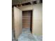 Basement storage closet features a cedar plank wall and concrete floor at 2518 Caladium Ne Dr, Atlanta, GA 30345