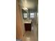 Bathroom features tiled flooring, large mirror, and a vanity with decorative lighting at 2518 Caladium Ne Dr, Atlanta, GA 30345