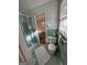 Bathroom featuring a walk-in shower and blue tiled walls with open doorway to a bedroom at 2518 Caladium Ne Dr, Atlanta, GA 30345