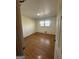 Bedroom features hardwood floors, neutral walls, and natural light from the window at 2518 Caladium Ne Dr, Atlanta, GA 30345