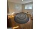 Bedroom features hardwood floors, neutral walls, natural light from the windows, and an oval area rug at 2518 Caladium Ne Dr, Atlanta, GA 30345