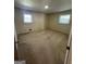 Bedroom features neutral walls, carpeted flooring, and natural light from the window at 2518 Caladium Ne Dr, Atlanta, GA 30345