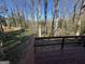 Wood deck overlooking a backyard filled with mature trees and lush greenery at 2518 Caladium Ne Dr, Atlanta, GA 30345