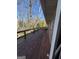 Outdoor deck with wood railing and a view of the surrounding trees at 2518 Caladium Ne Dr, Atlanta, GA 30345