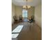 Cozy dining room with a chandelier and view of the yard through the window at 2518 Caladium Ne Dr, Atlanta, GA 30345