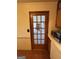 View from the kitchen looking through a glass paned door to the sunroom at 2518 Caladium Ne Dr, Atlanta, GA 30345