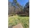 View of the property's sprawling green backyard, perfect for outdoor activities and enjoying nature at 1105 Bradford Park Dr, Auburn, GA 30011