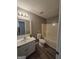 Bathroom featuring single sink vanity and shower/tub combo at 1105 Bradford Park Dr, Auburn, GA 30011
