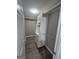 Walk-in closet with built-in shelving and laminate floors at 1105 Bradford Park Dr, Auburn, GA 30011