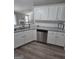 Kitchen showcasing stainless steel dishwasher, sink, and ample cabinet space at 1105 Bradford Park Dr, Auburn, GA 30011