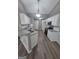 Bright kitchen features white cabinetry, granite countertops, and stainless steel appliances at 1105 Bradford Park Dr, Auburn, GA 30011