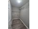 Laundry room featuring wire rack shelving and laminate floors at 1105 Bradford Park Dr, Auburn, GA 30011