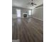 Bright living room with fireplace, modern flooring, and access to the outdoors at 1105 Bradford Park Dr, Auburn, GA 30011