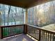 Lovely covered outdoor deck with beautiful views of the surrounding trees and landscape at 1521 Ashbury Park Dr, Hoschton, GA 30548