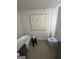 Modern bathroom with luxury toilet, soaking tub, and neutral wall art at 11523 Kimberly Way # 6, Hampton, GA 30228