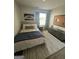 This neutral bedroom features a patterned rug, and window that offers natural light at 11523 Kimberly Way # 6, Hampton, GA 30228