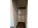Small closet featuring a shelf with minimal items and a smooth, clean wall and floor at 11523 Kimberly Way # 6, Hampton, GA 30228
