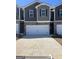 Attractive townhome featuring a two-car garage and brick and siding exterior in a desirable neighborhood at 11523 Kimberly Way # 6, Hampton, GA 30228