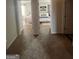 Hallway with views into bright, stylishly decorated bedrooms at 11523 Kimberly Way # 6, Hampton, GA 30228