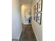 Inviting hallway adorned with stylish artwork and a decorative rug, creating a warm and welcoming entrance at 11523 Kimberly Way # 6, Hampton, GA 30228