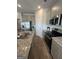 Modern kitchen featuring stainless steel appliances, granite countertops, and wood-look flooring at 11523 Kimberly Way # 6, Hampton, GA 30228