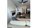 Spacious living room with modern fireplace, comfortable sofa, and ceiling fan, perfect for relaxation and entertaining at 11523 Kimberly Way # 6, Hampton, GA 30228