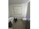This bathroom features a modern tub, stand-up shower, and unique tile flooring at 11551 Kimberly Way # 17, Hampton, GA 30228