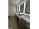 Stylish bathroom features a double vanity with modern sinks and granite countertop at 11551 Kimberly Way # 17, Hampton, GA 30228