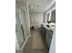 Bright bathroom featuring a glass shower, granite counters, and double sinks at 11551 Kimberly Way # 17, Hampton, GA 30228