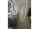 Bright bathroom featuring a glass shower, granite counters, and double sinks at 11551 Kimberly Way # 17, Hampton, GA 30228