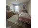 Bedroom featuring neutral paint, dresser, patterned rug, and window view at 11551 Kimberly Way # 17, Hampton, GA 30228
