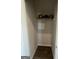 Small closet with a shelf and wood-look floors at 11551 Kimberly Way # 17, Hampton, GA 30228