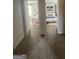 Hallway view of two bedrooms with carpeted floors and neutral walls at 11551 Kimberly Way # 17, Hampton, GA 30228