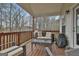 Relaxing back deck with outdoor seating and beautiful view of the surrounding forest at 130 Brooks Cir, Hampton, GA 30228