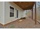A covered rear patio features an access door and a window to the main home at 130 Brooks Cir, Hampton, GA 30228