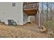 The backyard features a patio area underneath a deck and the home's rear facade at 130 Brooks Cir, Hampton, GA 30228