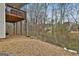 Backyard features a well maintained grassy area with a partially-covered patio at 130 Brooks Cir, Hampton, GA 30228
